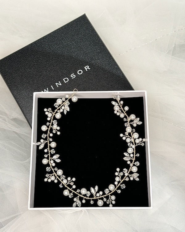 Single row Bridal vine in gold with crystal and pearl displayed in a black box