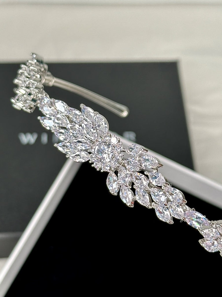 Close up of a modern bridal look headband in silver crystal 