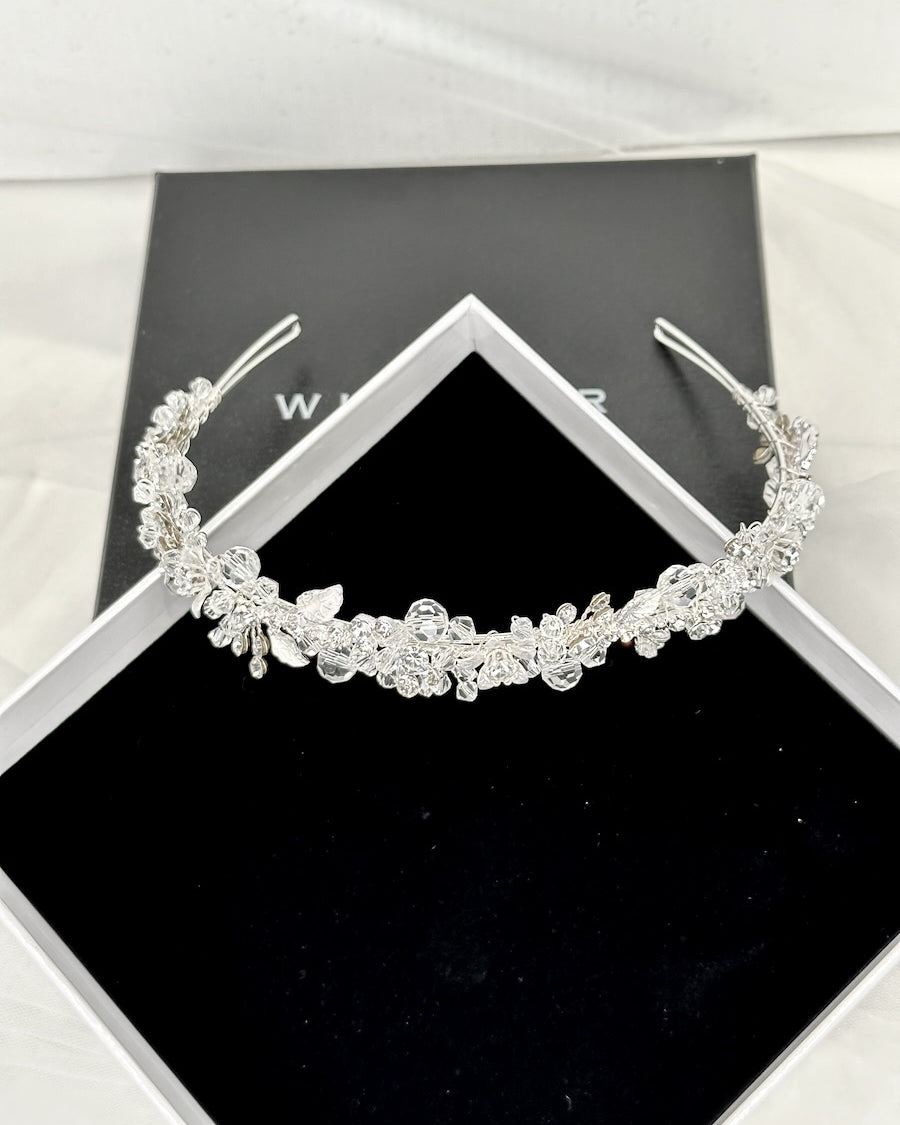 The Faith Silver Crystal headband shown inn a display box