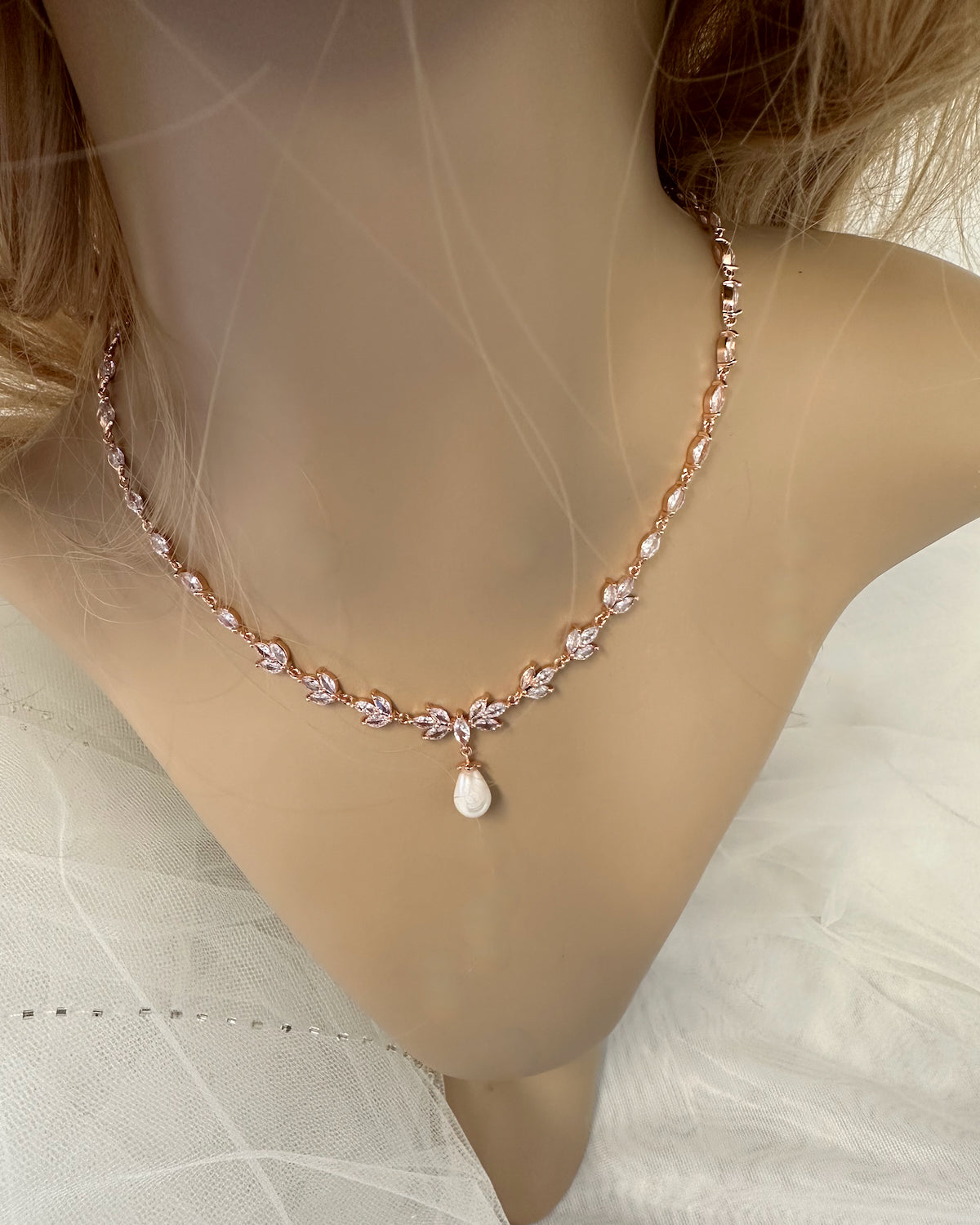 The Leah Rose Gold necklace worn on a model neck