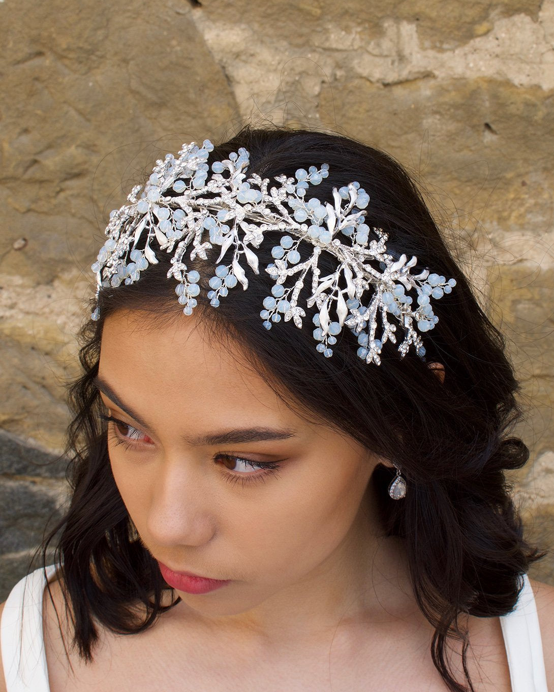 Silver Bridal Headband with Swarovski White opal beads worn on a dark hair bride