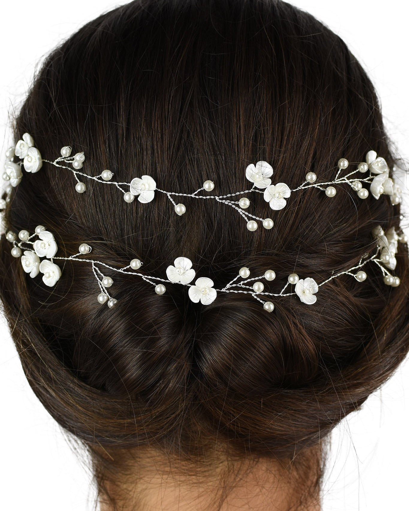 Close up of a 2 row silver vine on the back of a dark hair model with a white backdrop