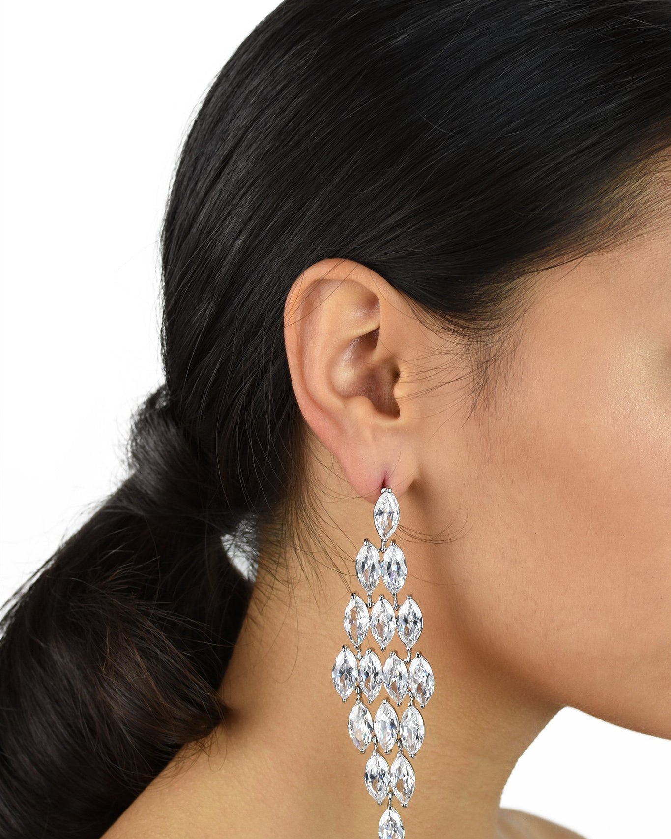 Long Bridal Earrings with Zirconia stones shown on a dark haired Bride