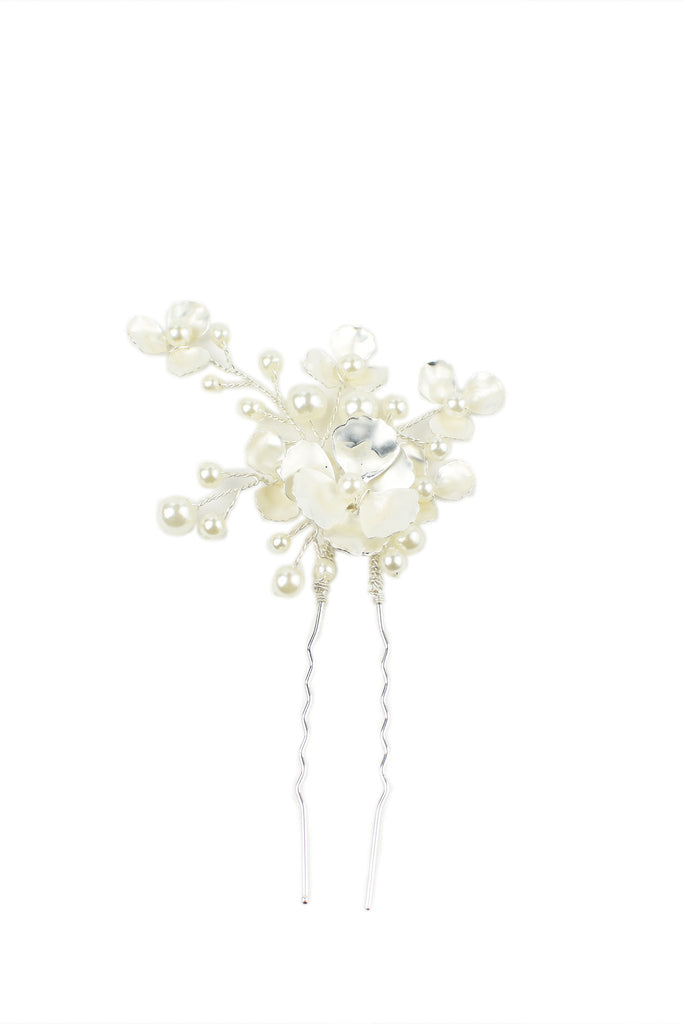 Silver and pearl hair pin on a white background