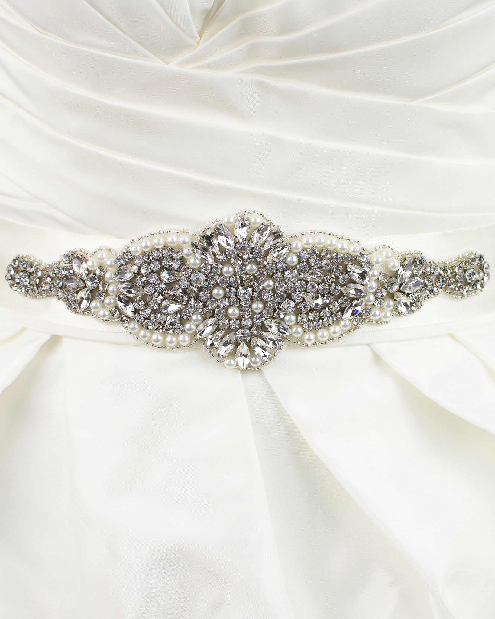 A short wide bridal belt worn on a bridal dress