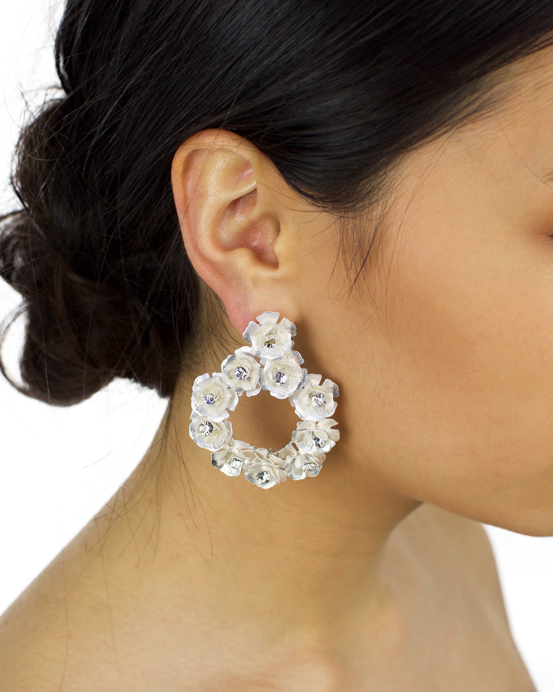 Soft Silver Flowers Bridal Earring worn by a bride with up hairdo