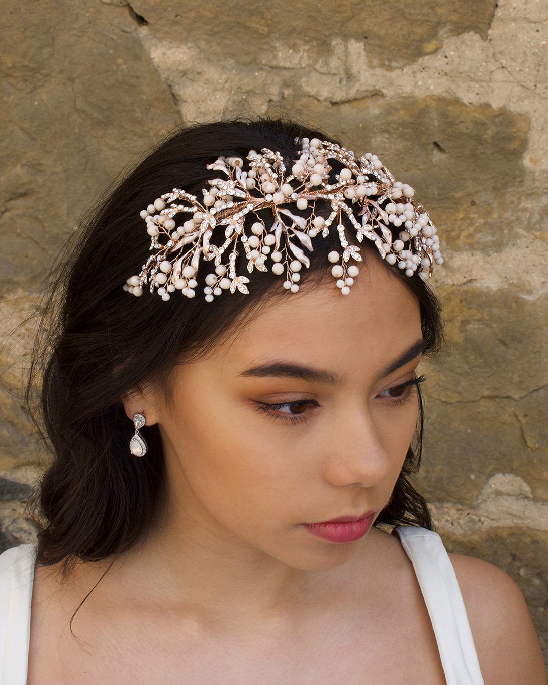 Rose Gold Headband with coral colour beads on a dark haired bride