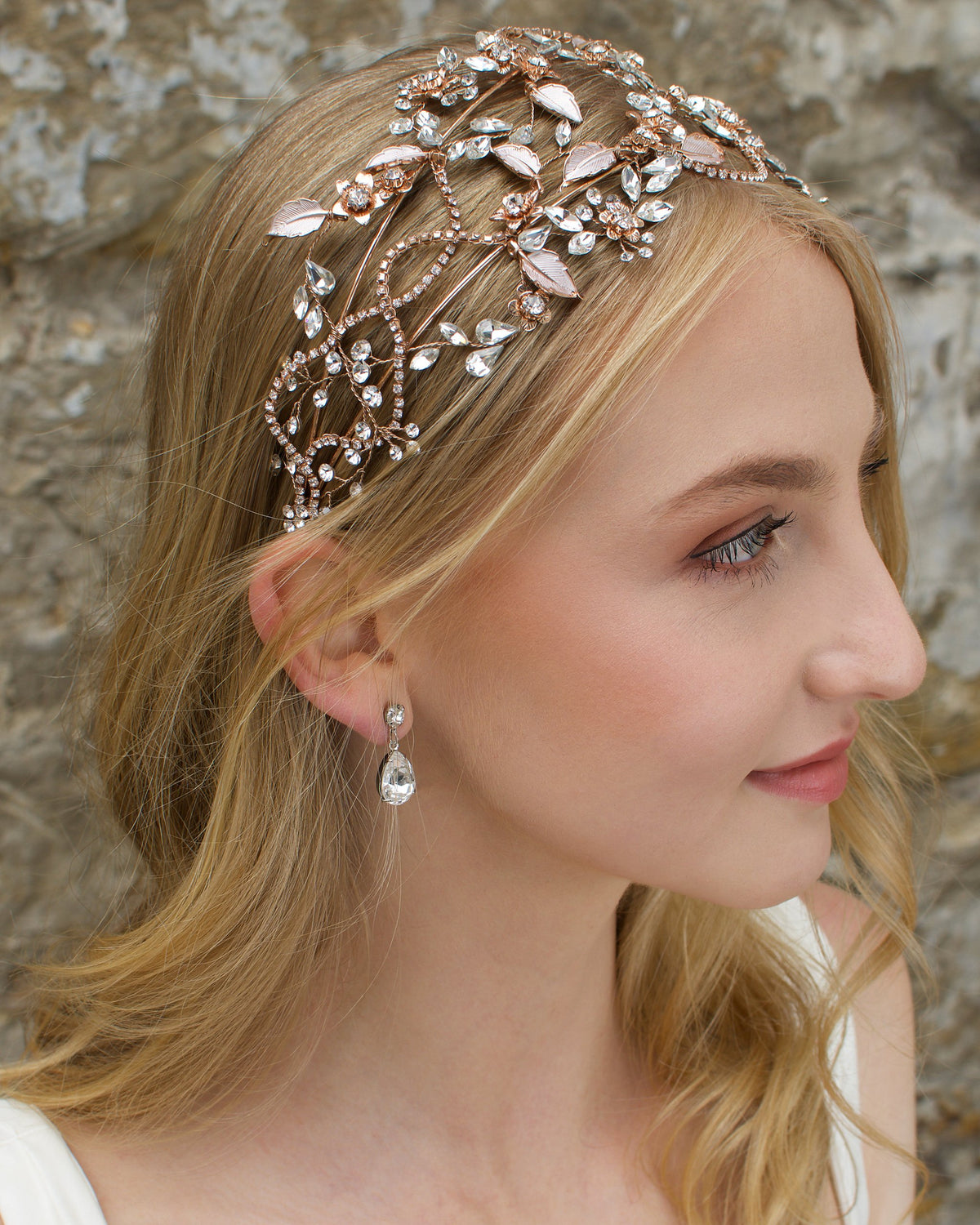 Rose Gold wide headband with clear stones worn by a blonde model