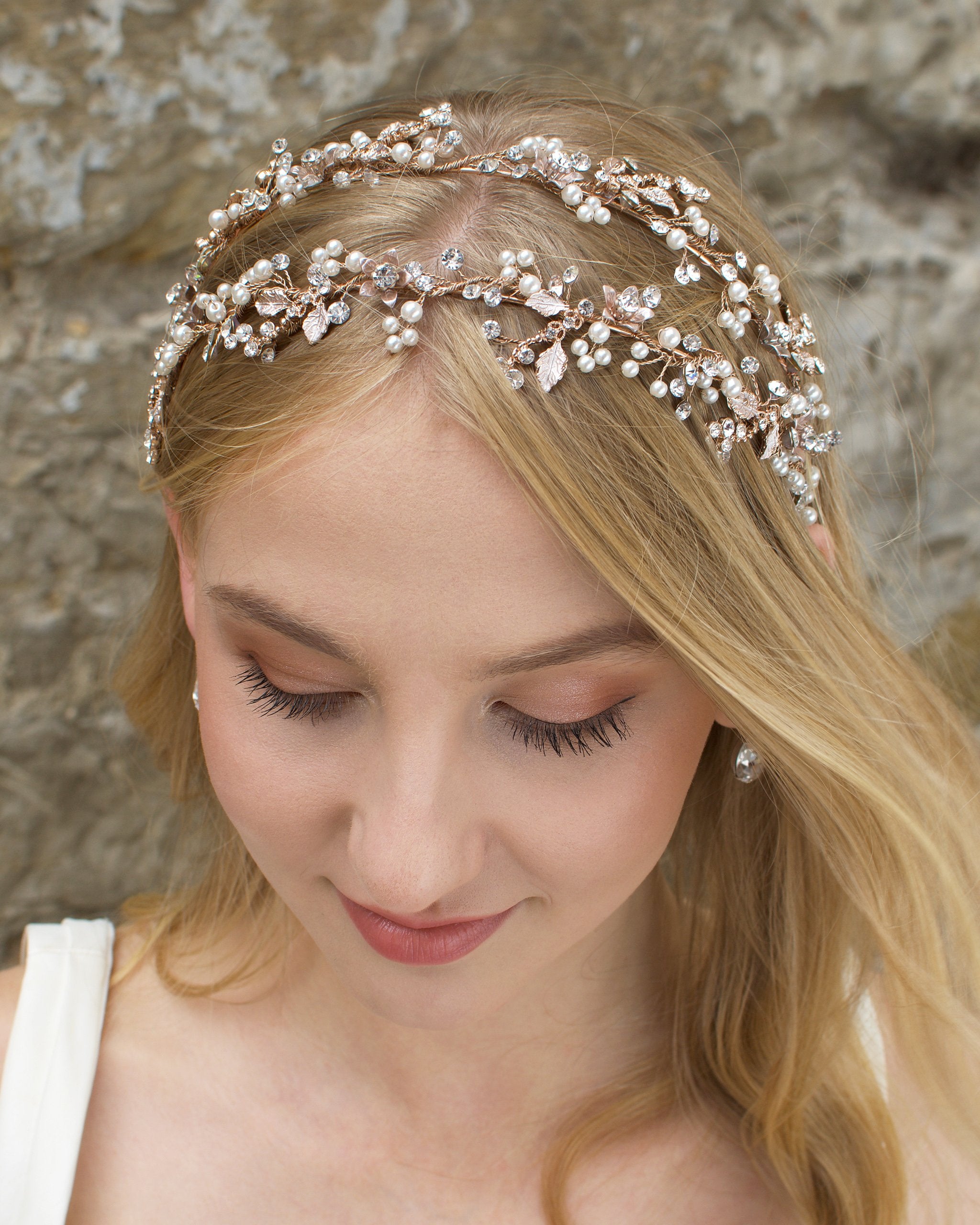 Double row pearl and rose gold headband worn by a blonde model