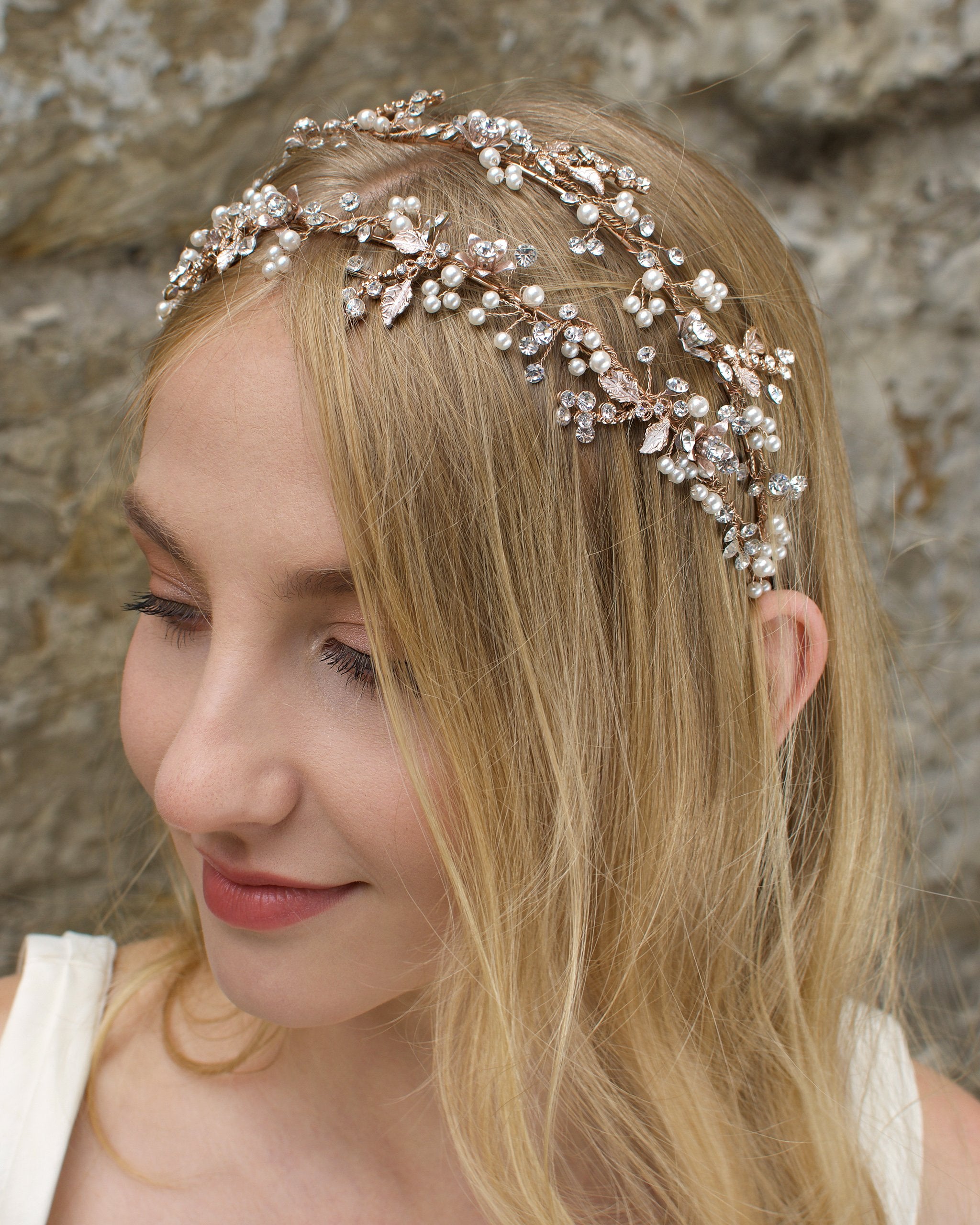 Smiling model wears a double row headband in pearl rose gold on her blonde hair