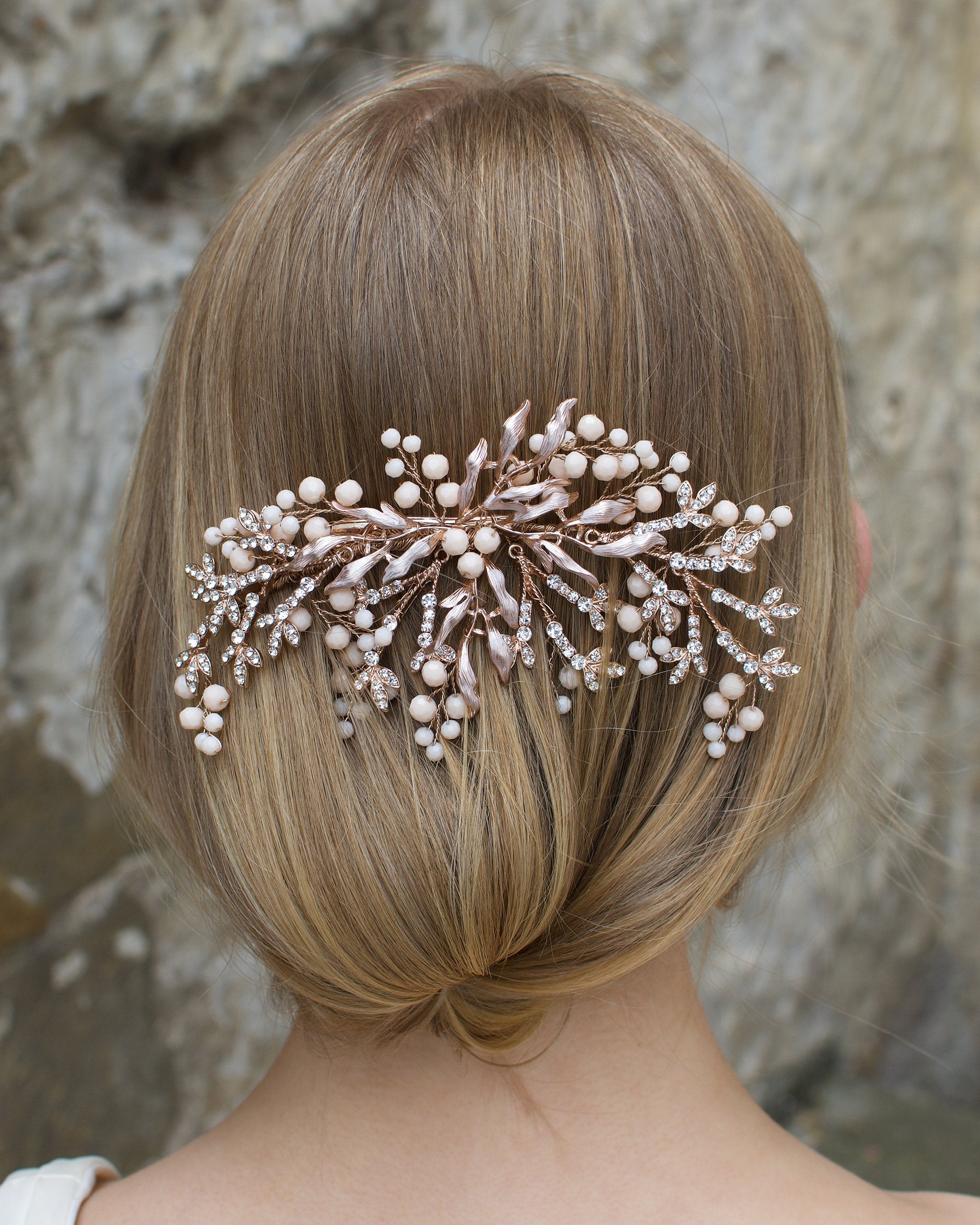 Pale Rose Gold Bridal Comb with Coral Swarovski Beads shown on a blonde hair Bride