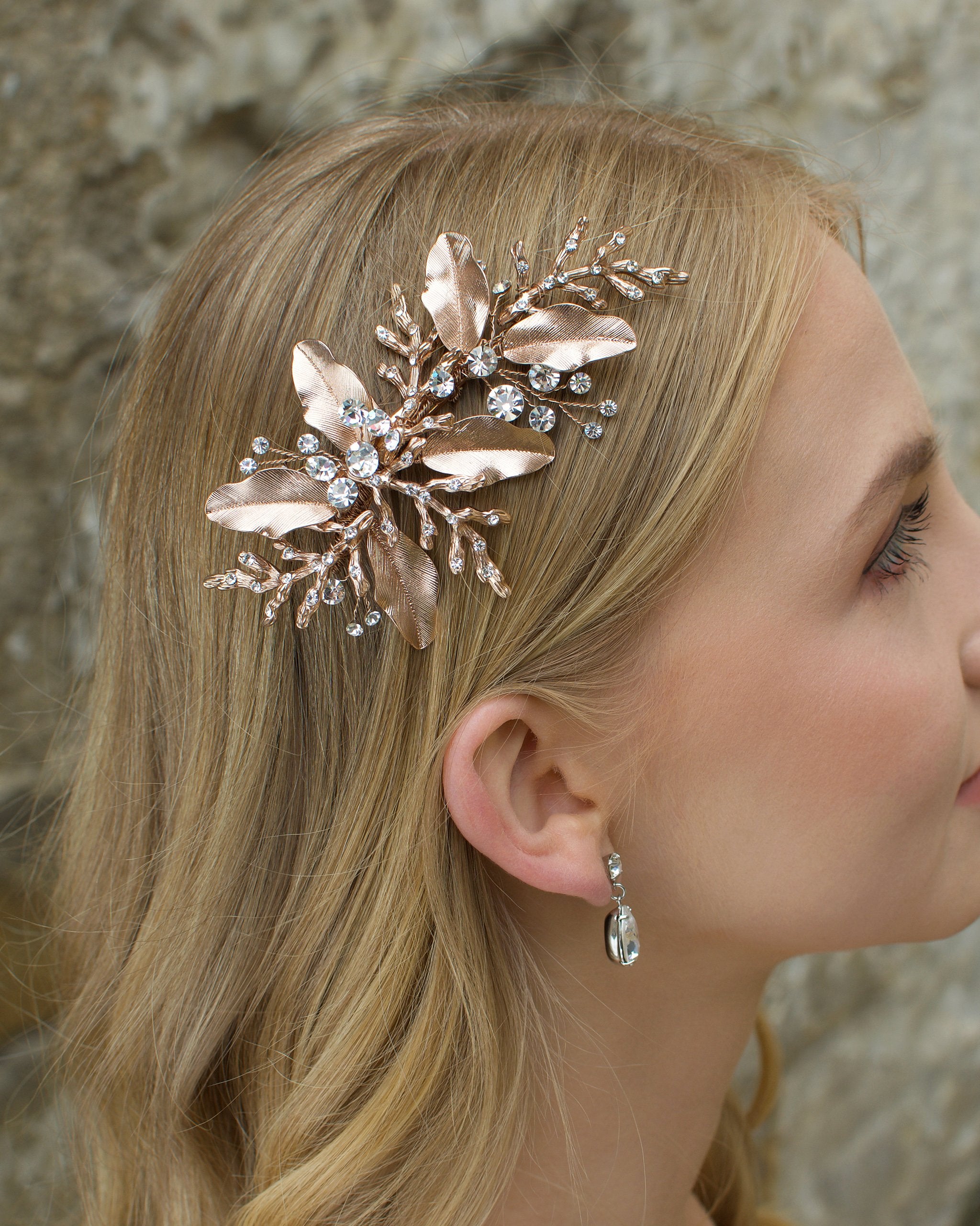 Rose gold leaves and twigs bridal side comb worn by a blonde model