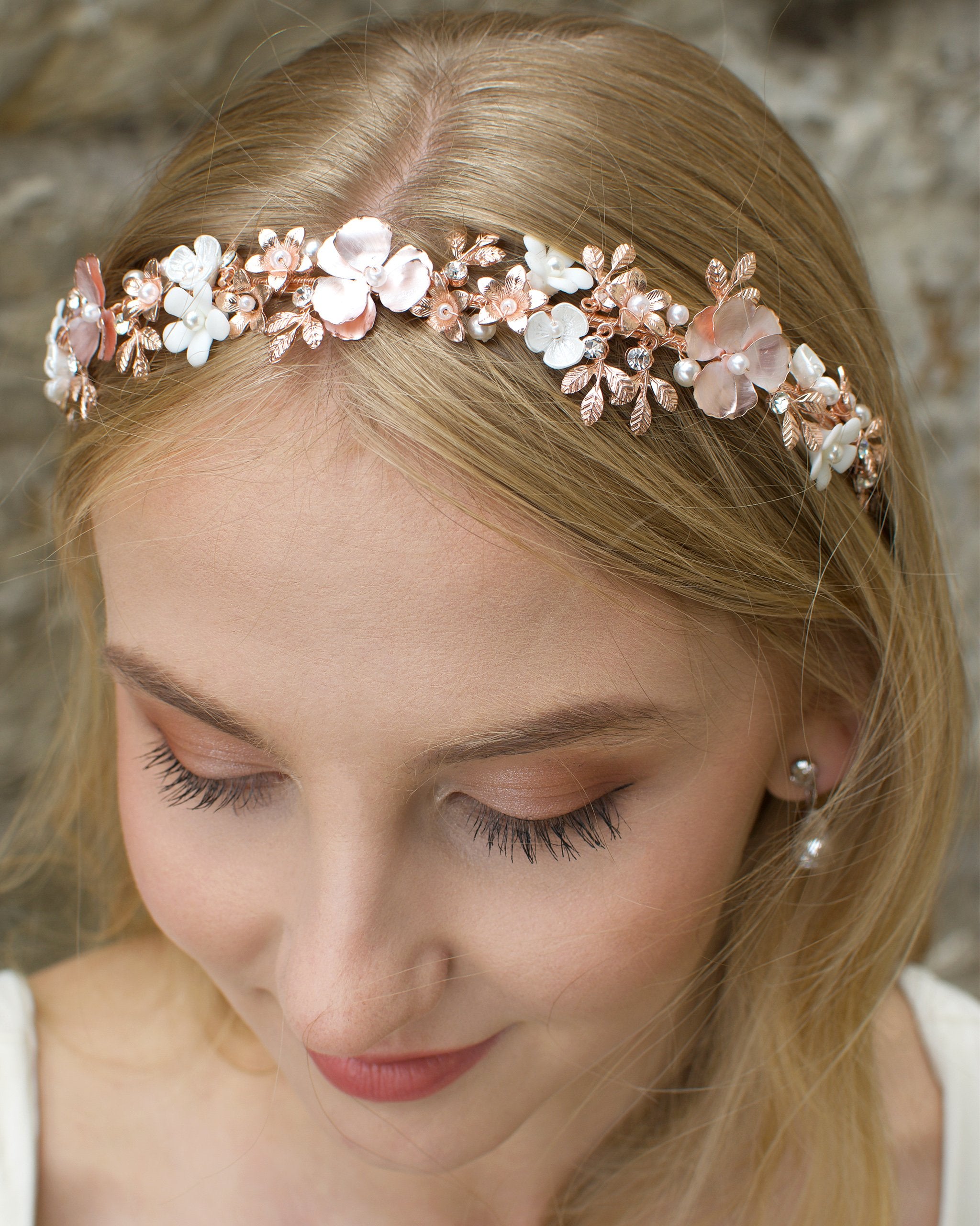 Blonde Bride wearing a pale rose gold headband with ceramic flowers