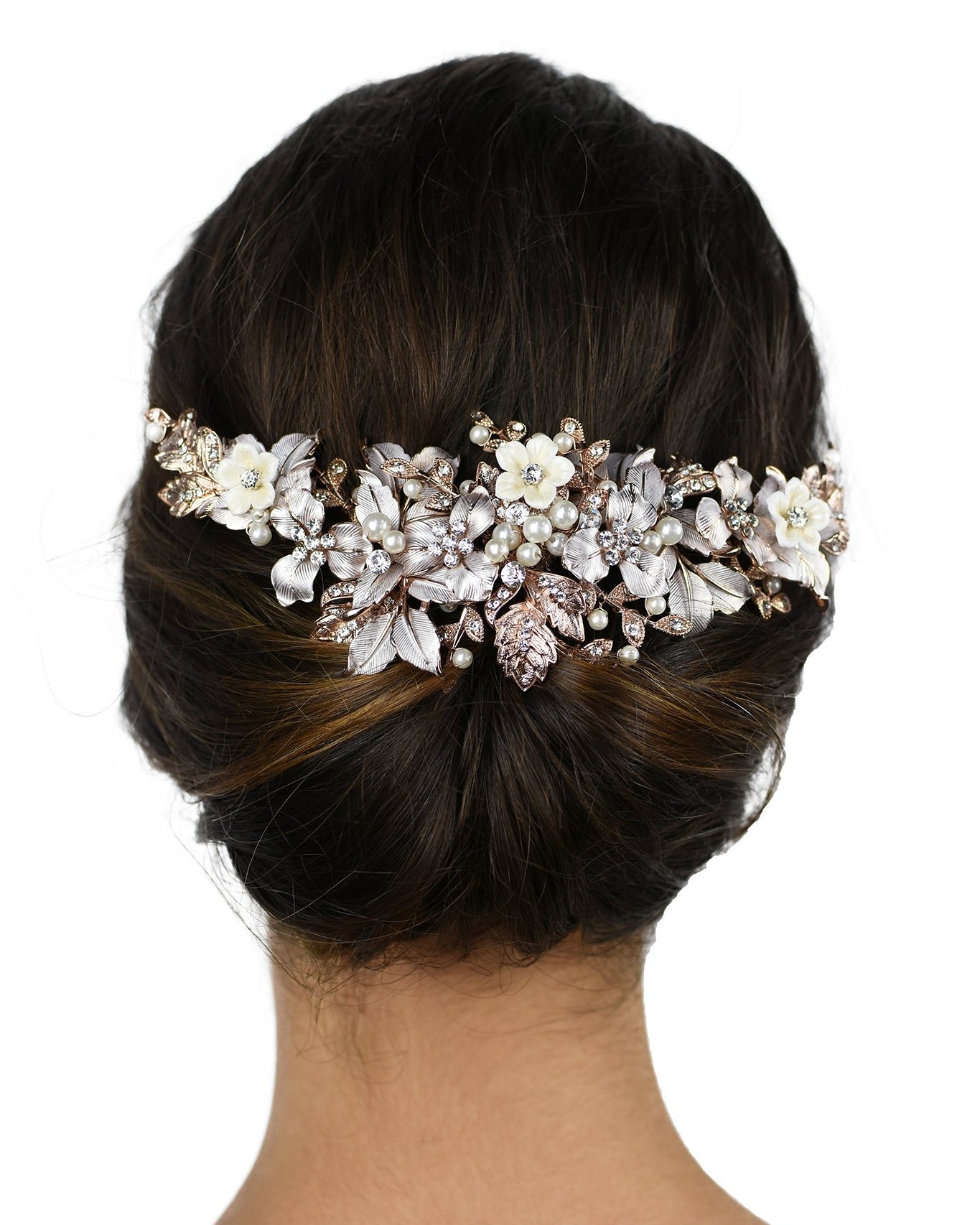 Pale Rose Gold Bridal Headpiece with ceramic flowers worn at the back of a models head with a white background
