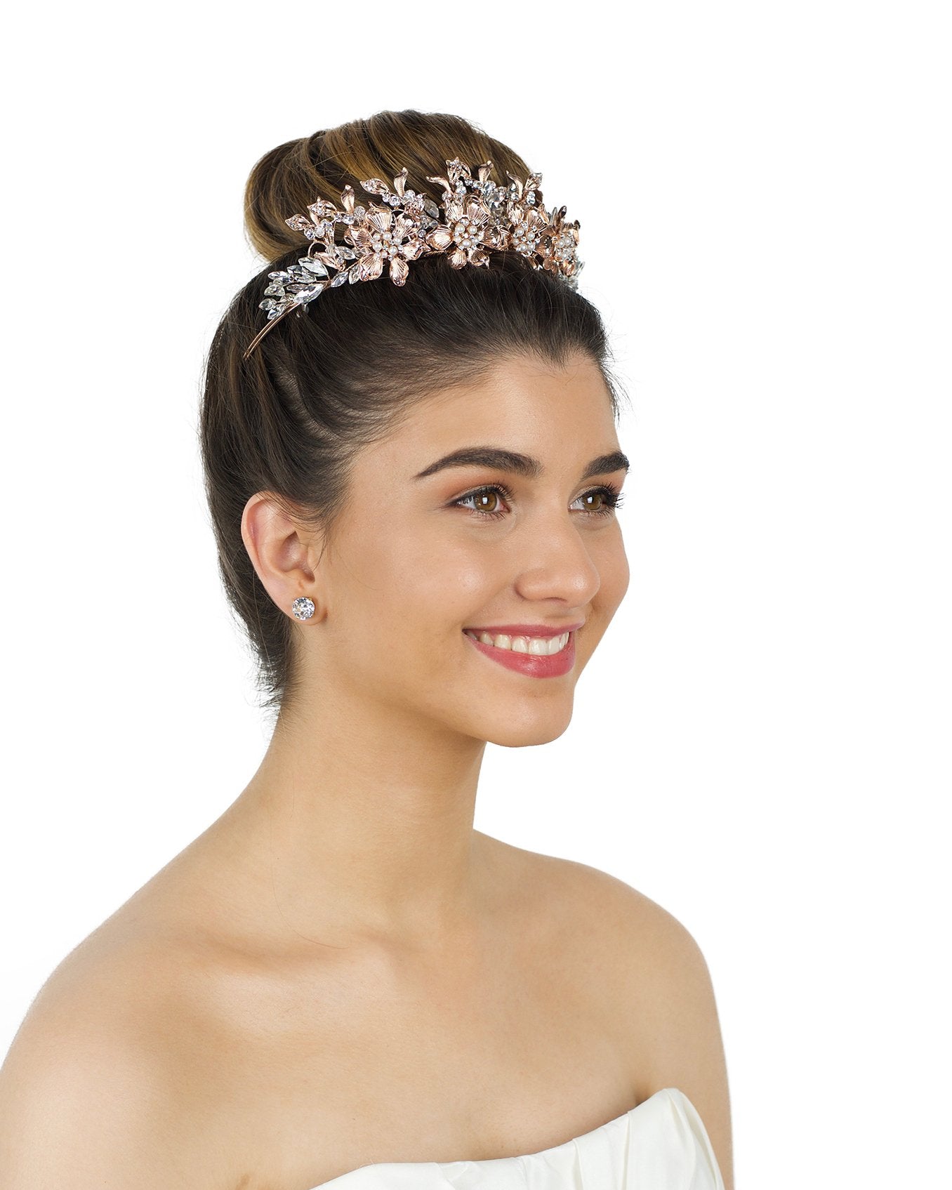 Rose Gold Crown worm by a smiling bride in an ivory bridal gown with a white background