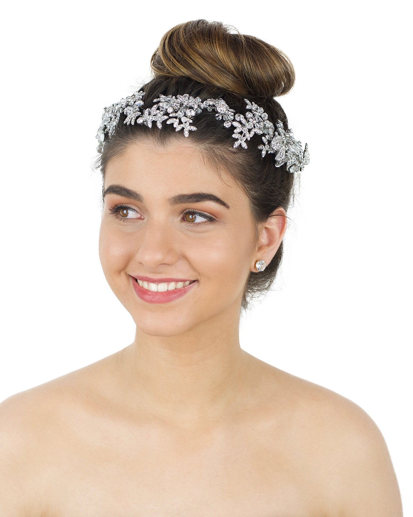 Brown eye Brown hair smiling model wearing long silver bridal vine with white backdrop