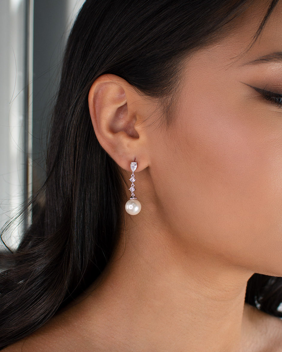 Brielle Silver Pearl Bridal Earring worn by a dark haired model