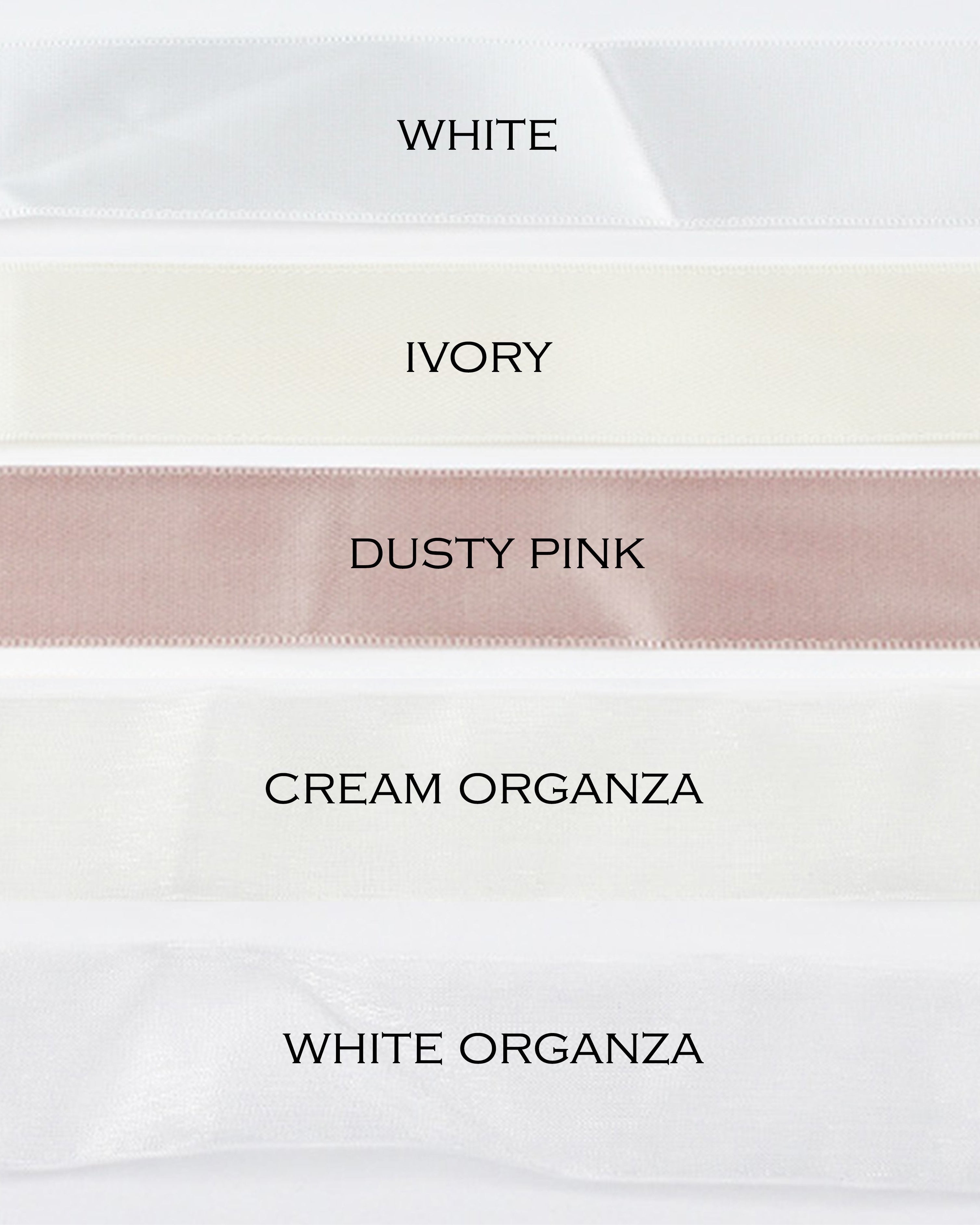 five different colours of satin ribbon on a white background