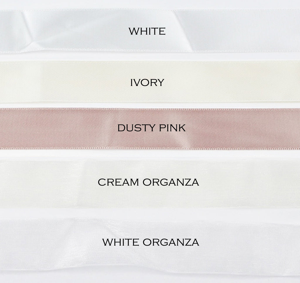 five different colours of satin ribbon on a white background