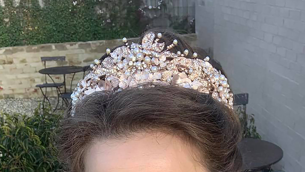 Bride with brown hair wearing pink crown 
