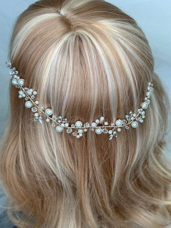 Bridal vine with crystal and pearl with gold wire worn on a model head