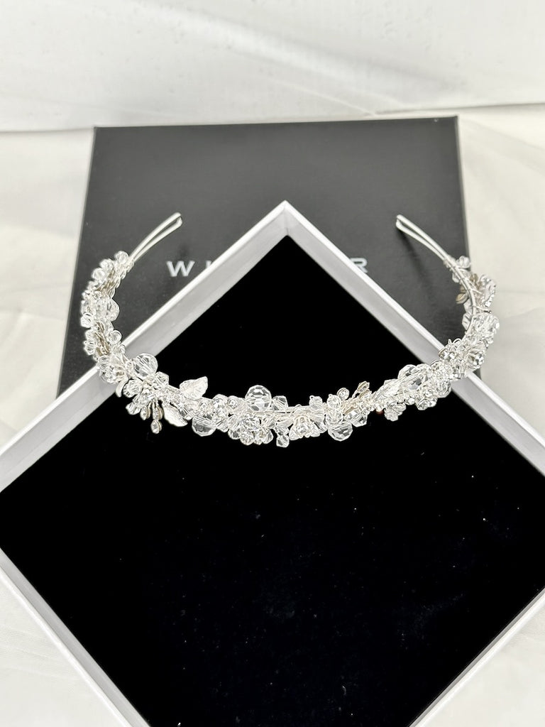 The Faith Silver Crystal headband shown inn a display box