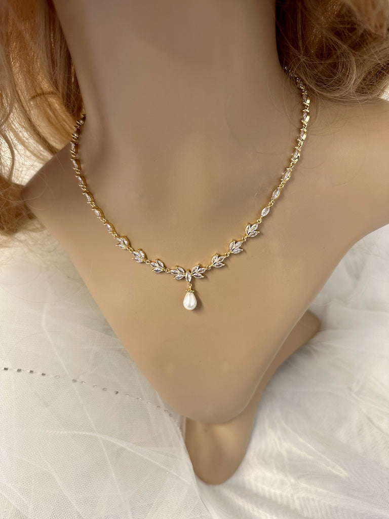 Leah Gold Necklace a beautiful pale gold bridal necklace on a model neck