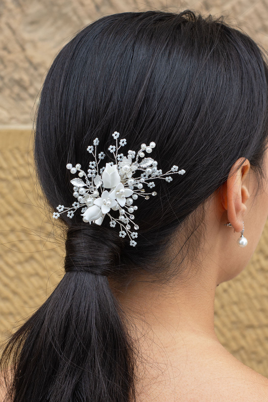 Kiara Silver Bridal Clip worn on a dark haired model