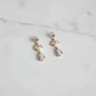 Bettie Gold Bridal Earring - white marble flat lay