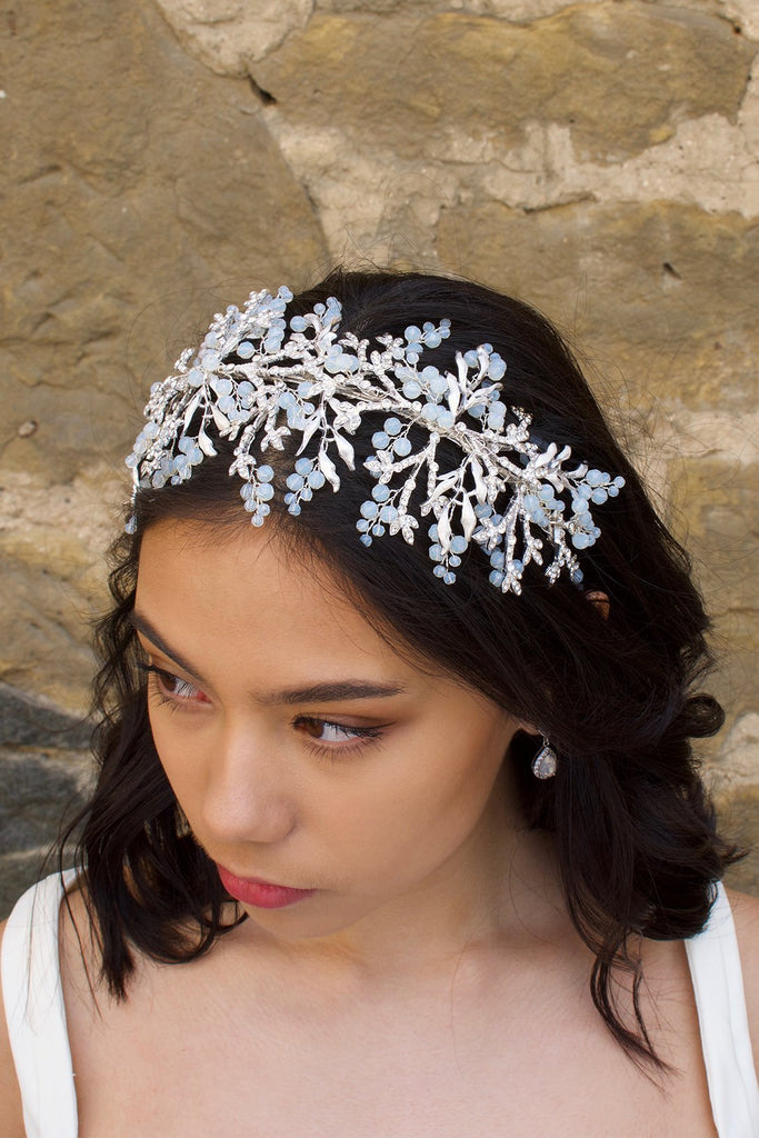 Silver Bridal Headband with Swarovski White opal beads worn on a dark hair bride