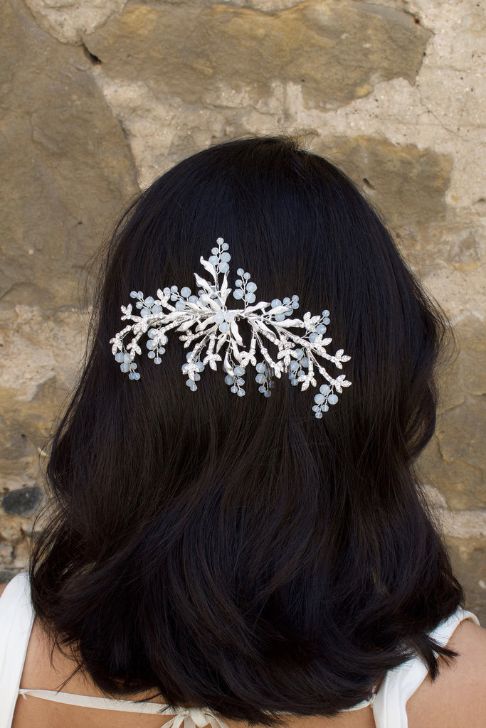 Silver Bridal Side Comb with Swarovski White Opal beads shown on a popular bridal hairstyle