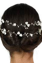 Close up of a 2 row silver vine on the back of a dark hair model with a white backdrop