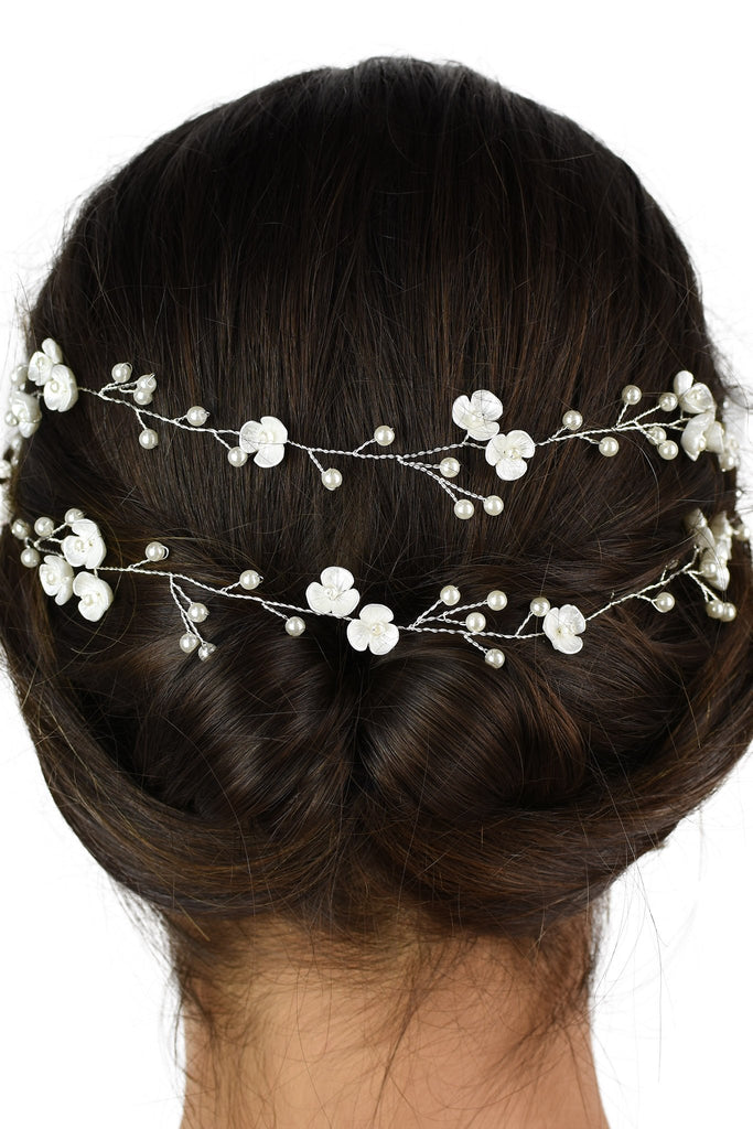 Close up of a 2 row silver vine on the back of a dark hair model with a white backdrop