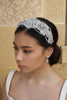 Wide Pearl Bridal Headband worn by a dark bridal model with a sandstone backdrop