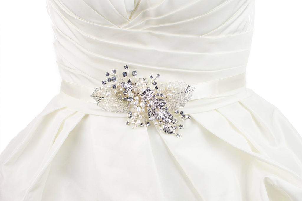Silver filigree leaves and real pearls are on a Bridal Belt made on ivory satin and worn on an ivory satin gown