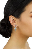 Small handmade Swarovski Earring worn by a bride with up style hair