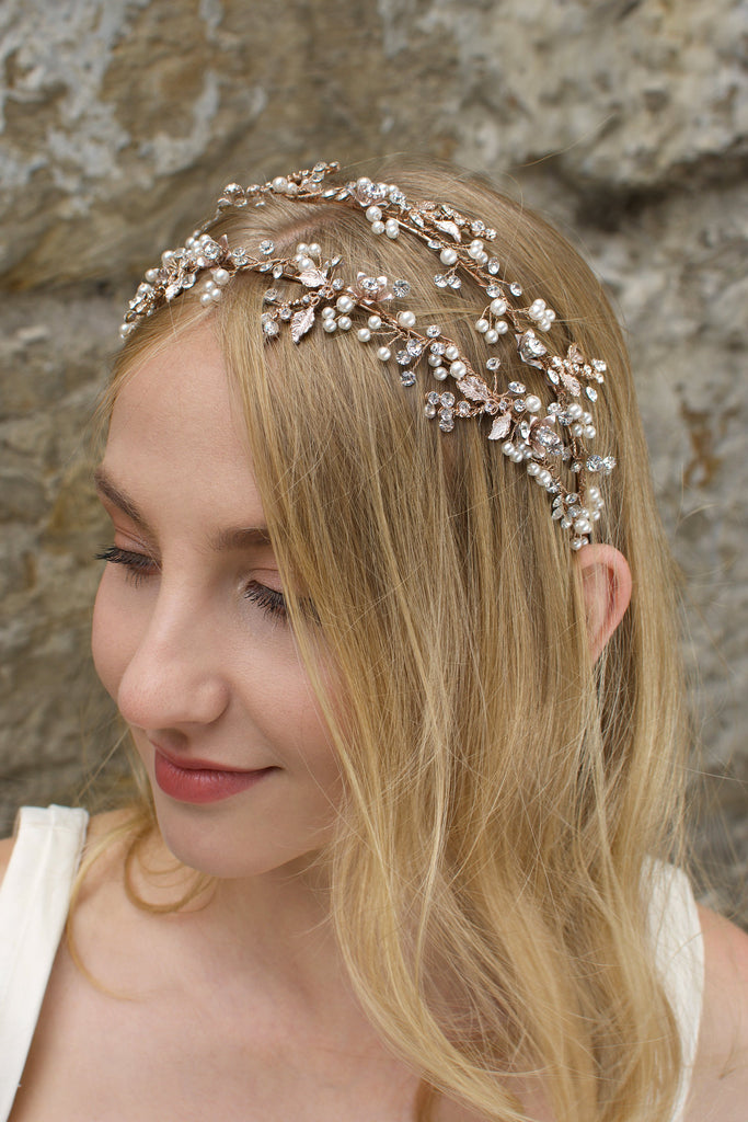 Smiling model wears a double row headband in pearl rose gold on her blonde hair