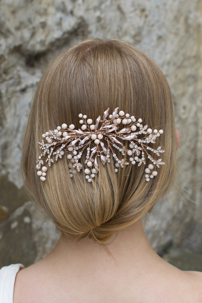 Pale Rose Gold Bridal Comb with Coral Swarovski Beads shown on a blonde hair Bride