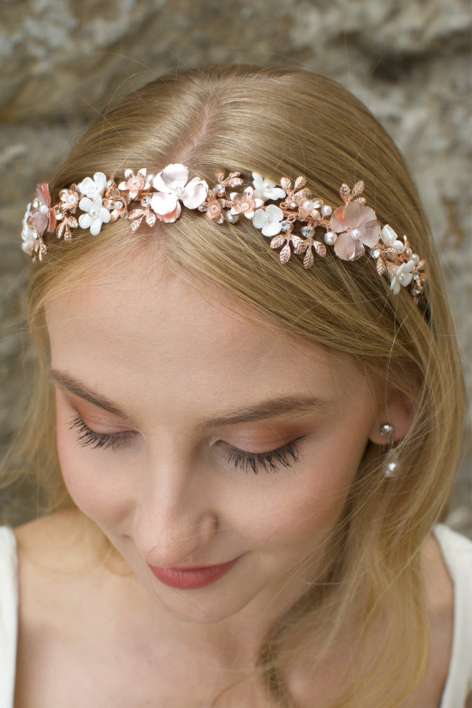 Blonde Bride wearing a pale rose gold headband with ceramic flowers 